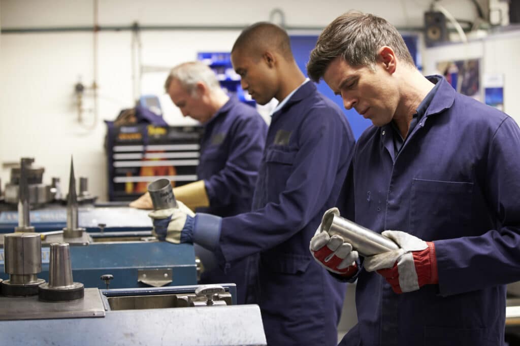 Manufacturing supervisor comparing staffing model options for a production facility